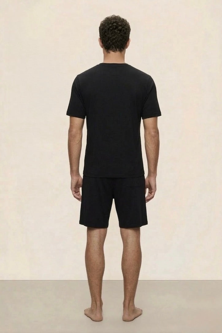 Man wearing a black t-shirt and shorts Dubai, Saudi, Abu Dhabi